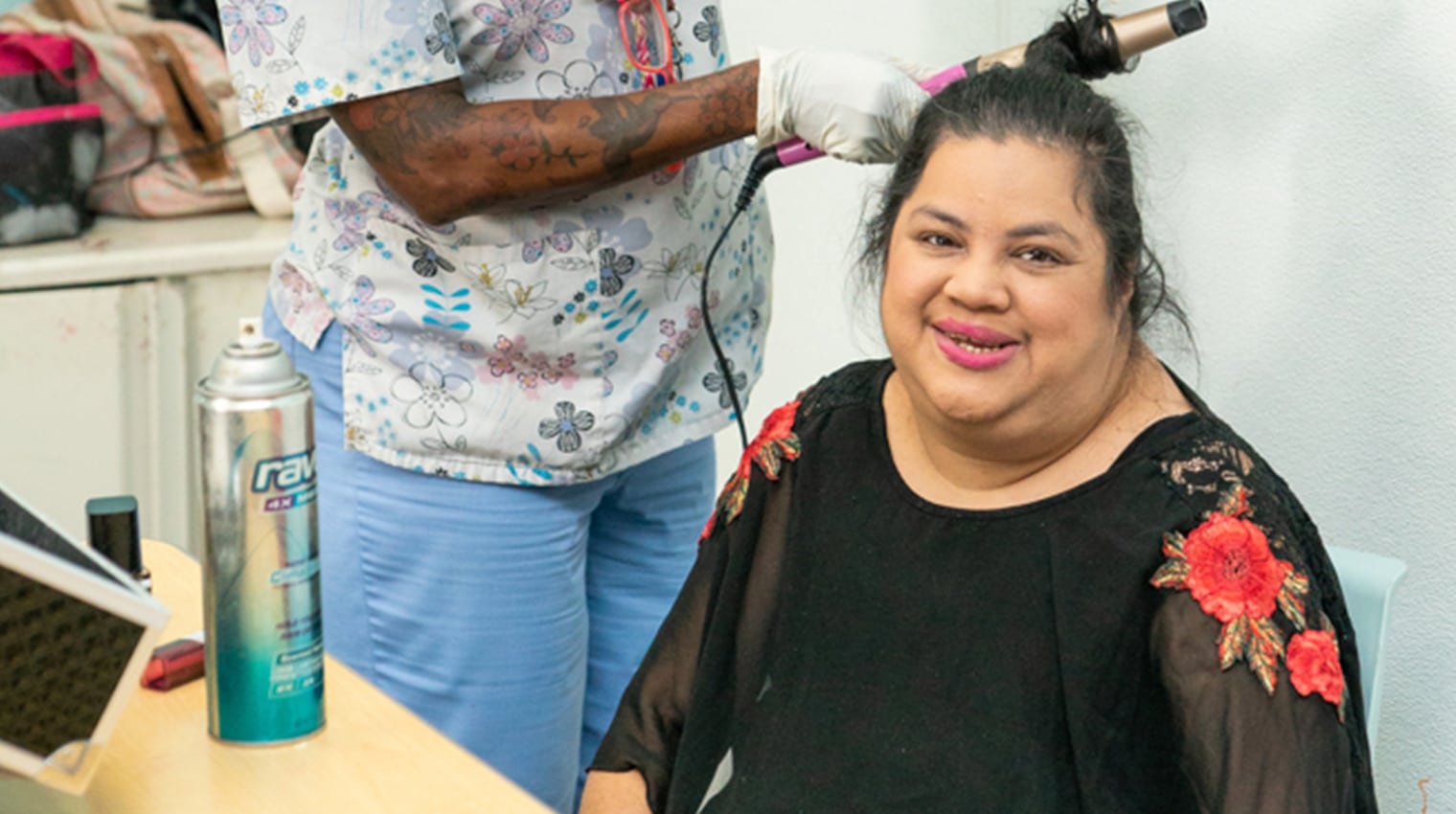 Woman getting her hair styled