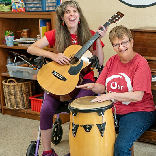 Tailored Day Services Two women playing instruments