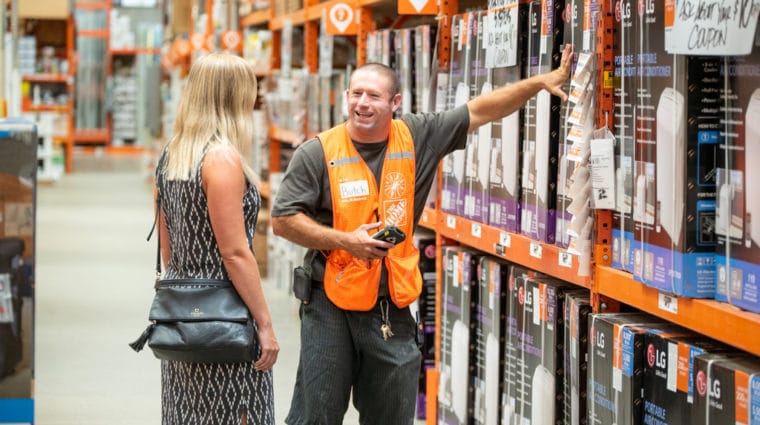 Hardware store employee helping a customer