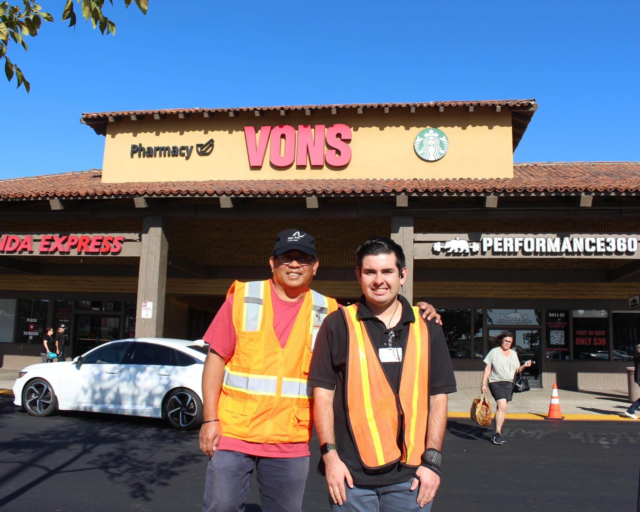 Anthony, Sean's job coach, and Sean at Vons